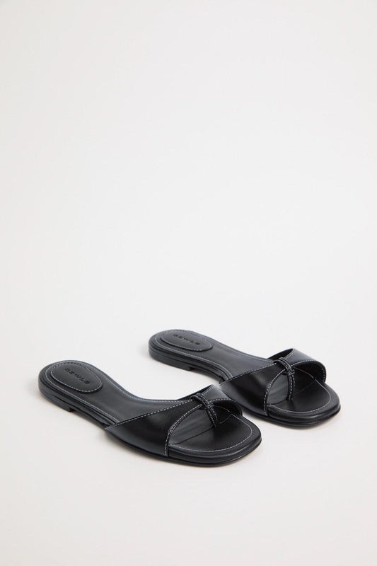 The Chiara Sandal in rich Nero Nappa Leather. Italian handcrafted with LWG-certified leather, a rounded toe, and padded insoles for all-day comfort. A luxury staple.